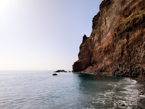Coastal Cliffs and Pier in the small coastal village Madalena do Mar (Madeira, Portugal)