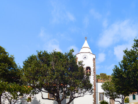 Church of S&atilde;o Salvador in Santa Cruz with blue sky, historic parish church (Madeira, Portugal)