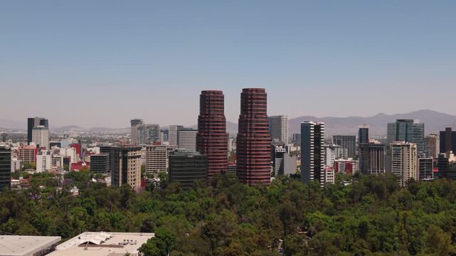 Aerial parallax shot of Polanco skyline from Chapultepec park