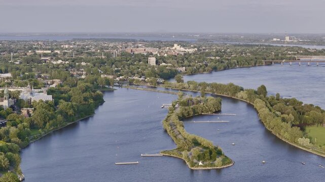 Aerial view of Rene-Levesque Park lighthouse peninsula in Lachine, Montreal along St Lawrence River at sunset. g.