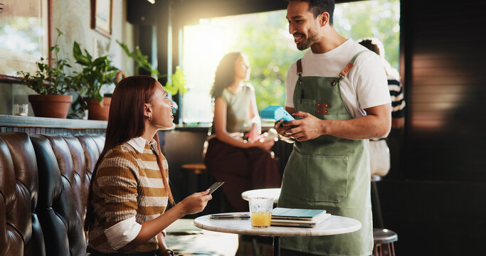 Woman, credit card and waiter with pos at coffee shop, order and happy customer experience at diner. People, server and smile with easy payment at cafe, fintech or machine with thanks at restaurant