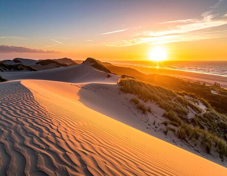 A breathtaking panoramic view captures a serene sunset over a coastal dune landscape, showcasing the interplay of golden light and the tranquil ocean.