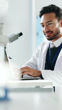 Man, scientist or laptop with microscope for forensic research, medical study or exam in laboratory. Male person, checking or healthcare worker on computer for scientific test results or clinic trial