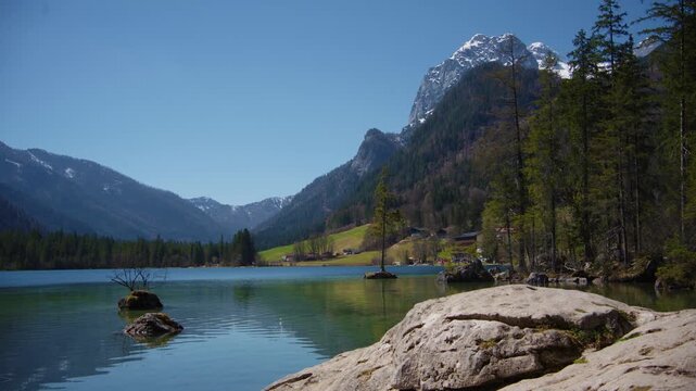 Hintersee lake in Berchtesgaden with turquoise water, rocky islands and mountain panorama, Bavaria