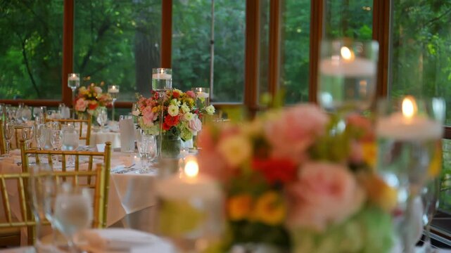 Elegant wedding table setup with lighting candle and flowers . lighting candle near floral centerpiece and table decor.