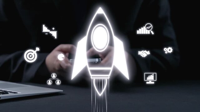 A person is using a smartphone while a rocket icon symbolizes business growth. This image captures innovation and entrepreneurial spirit in a modern workspace. Qubit