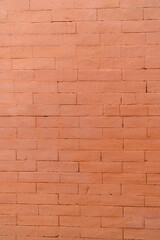 Fototapeta premium Orange brick wall texture with clean horizontal pattern, construction background for architecture, design, and copy space