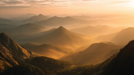 Obraz premium Serene Mountain Landscape at Sunrise with Soft Mist and Warm Golden Light Overrolling Hills and Valleys in a Tranquil Natural Setting