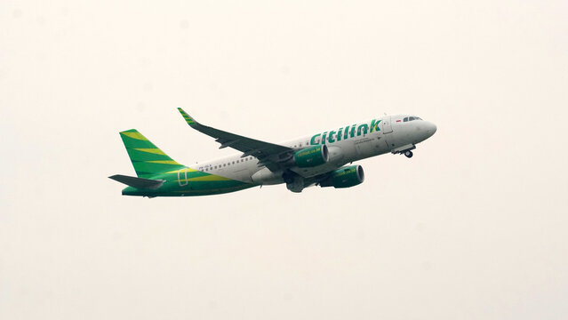 Aerodynamic view of Citilink airline aircraft soaring through the atmosphere with visible sharklets on the wingtips on April 17, 2026 in Soekarno-Hatta Interational Airport, Jakarta, Indonesia.