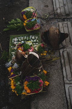 Overhead view of multiple Balinese canang sari offerings, Bali
