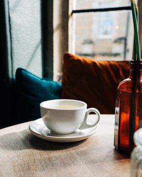 steaming cup of tea on a table in a cafe in England