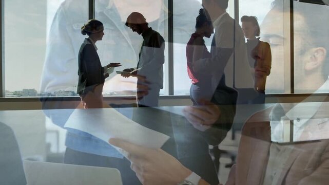 Team exchanging document, hands typing, exchange initiating overlay charts for business review