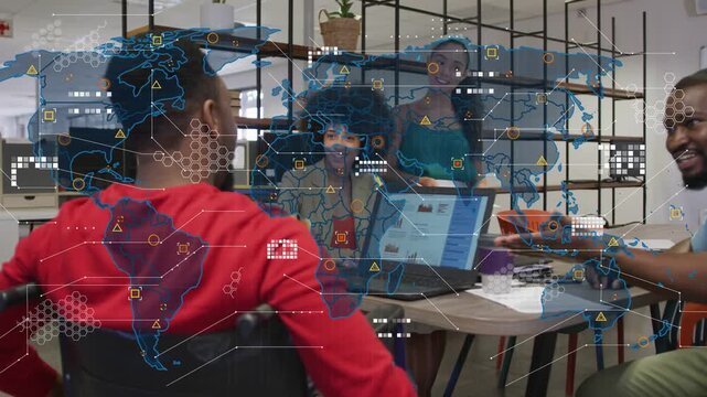 Team of four meeting, laptop initiating global map overlay, pointing and analyzing business metrics