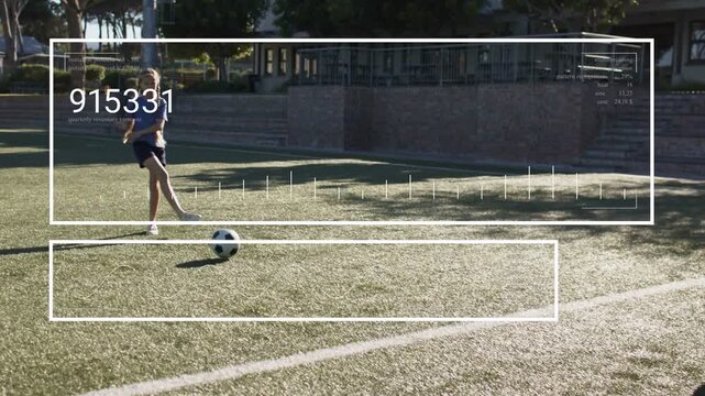 Girl training soccer on turf doing touches then kicking ball rolling HUD tracking male intercepting