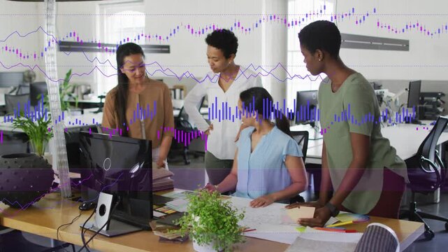 Seated designer turning pages, team leaning in, animated charts overlaying desk, finalizing layouts