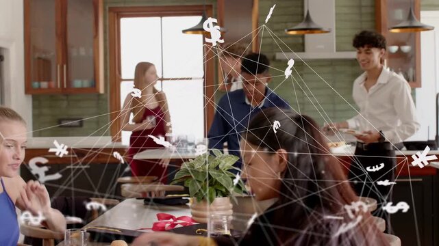 Two seated women tapping smartphone and sparking animated currency network over graduation table