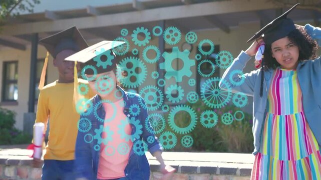 Teal gear appearing hiding faces three grads waving scrolls and fixing caps celebrating graduation