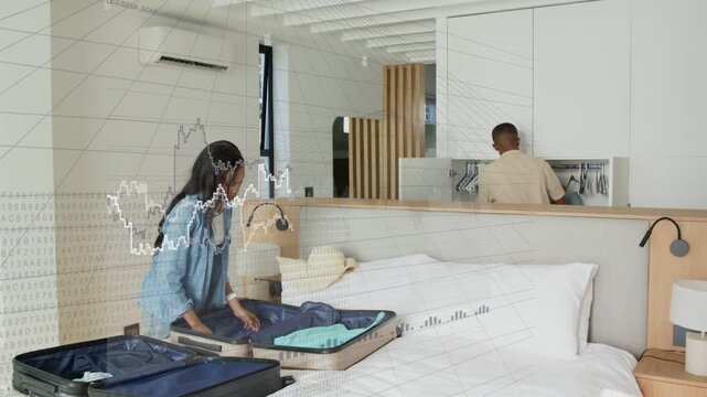 Vertical video: Packing couple in denim and beige arranging suitcases on bed, packing for trip