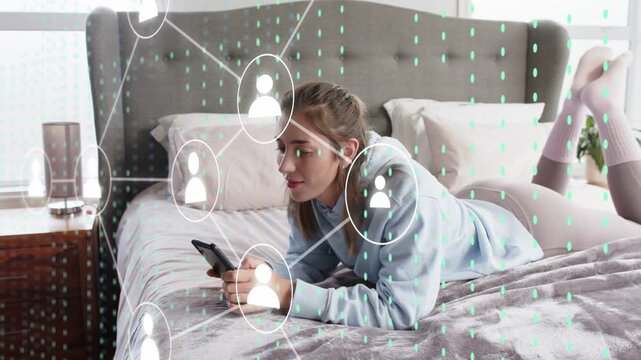 Mid-adult woman on bed tapping phone, generating growing network overlay with user icons for social