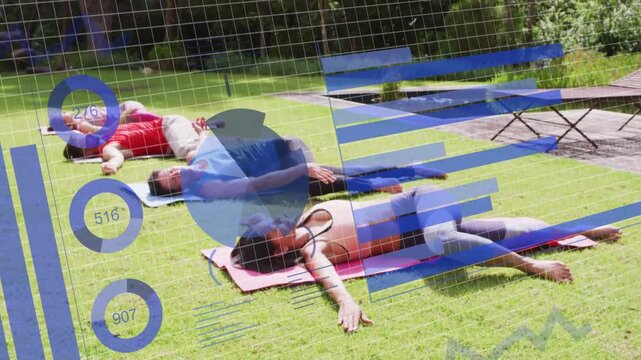 Group lying on lawn, following guided fitness cues while blue overlay charts highlighting movement