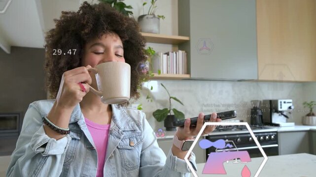 Woman in kitchen bringing mug, speaking into device and tapping, AR hexagons timing brew technology