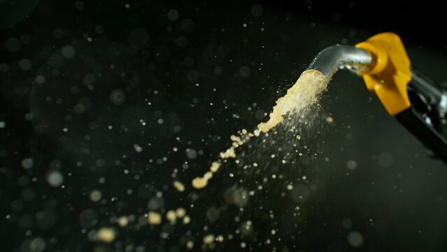 Close-up of Gasoline Spurting from the Gas Pump Nozzle