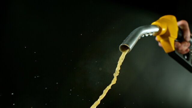 Close-up of Gasoline Spurting from the Gas Pump Nozzle