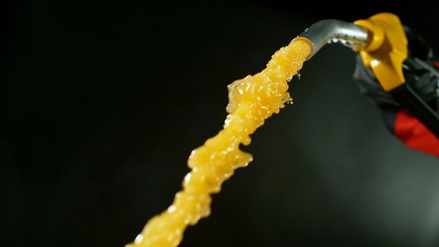 Close-up of Gasoline Spurting from the Gas Pump Nozzle
