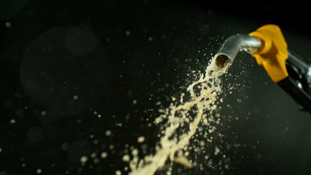 Close-up of Gasoline Spurting from the Gas Pump Nozzle