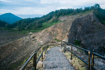 Mystical volcanic crater lake of Kelimutu in Flores during early morning light. © Fahmi