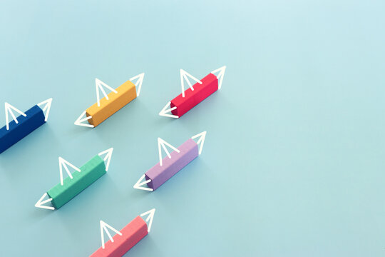 Concept image of wooden cube and boat metaphor. Idea of leadership and education