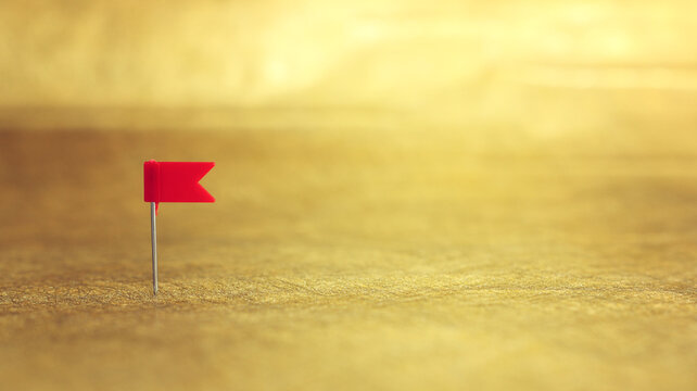 push pin on golden background