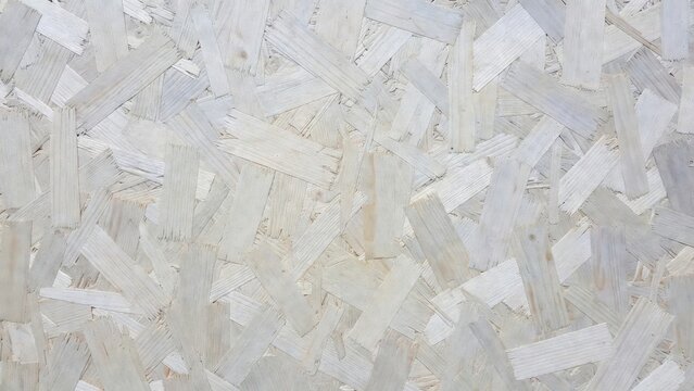 Painted wood chipboard showing textured panel surface background