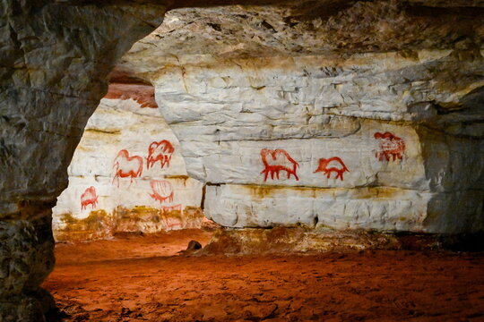 Ancient rock paintings of animals in a grotto in the Sablinsky Caves, Leningrad region of Russia