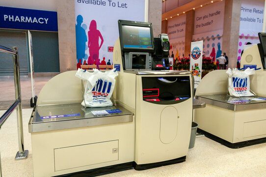 Self-service tills in a Tesco Store
