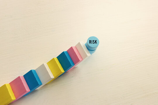stopping the domino effect. executive and risk control concept