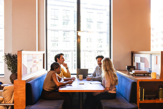 Group of Four Young Adults in Office Team Environment