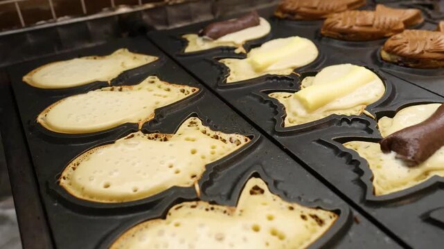 Chef Preparing Traditional Fish Shaped Taiyaki Cakes at Kuromon Market Osaka