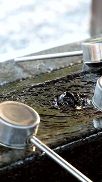 Water Bubbling in a Stone Temizuya Basin at Oyama Shrine