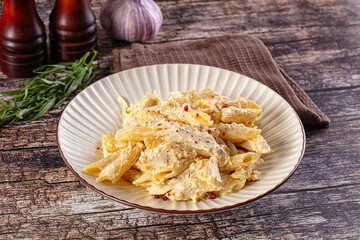 Creamy pasta Alfredo with chicken © Andrei Starostin
