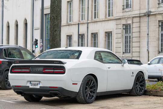 Nancy, France - April 2nd 2022 : View on a white Dodge Challenger SRT parked on a parking lot.