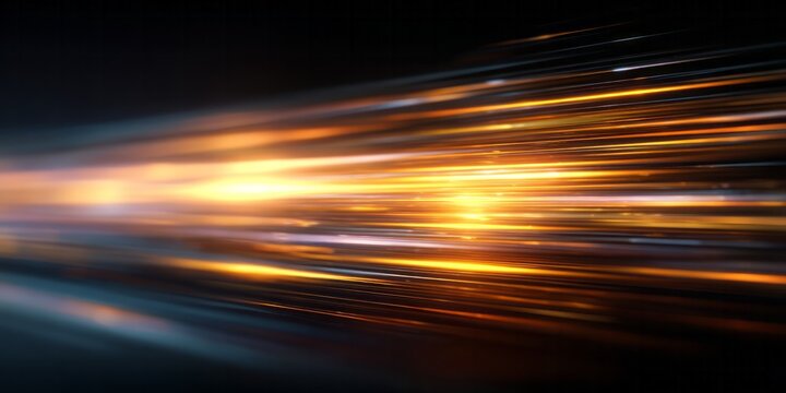 Streaks of golden light move rapidly across a dark background.