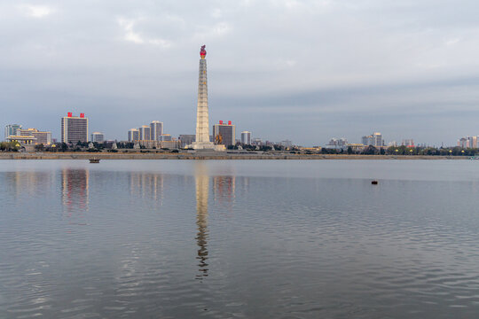 Juche Tower, Pyongyang morning panoramic view, North Korea. Taedong River in the morning fog. View facing upstream, modern residential complex. View from Yanggakdo Hotel