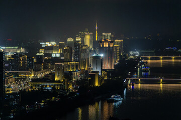 Fototapeta premium Panoramic view of Pyongyang from Yanggakdo Hotel. Taedong River in morning fog. Ryugyong Hotel and modern residential complex upstream. Atmospheric, calm, iconic. Pyongyang, North Korea