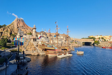 Historic ship and Mediterranean Harbor view framed by stone archway at Tokyo DisneySea, Japan © PROMA