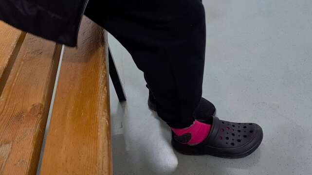 A person who has difficulty walking due to a broken toe.