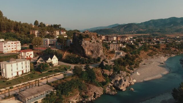 Beautiful aerial perspective of the town of Permet in Albania. The Vjosa river flows alongside the city surrounded by lush mountains