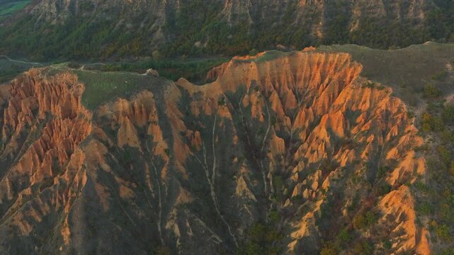 Amazing aerial view of the Stob Pyramids, a stunning natural landmark in Bulgaria, glowing with warm light during the golden hour