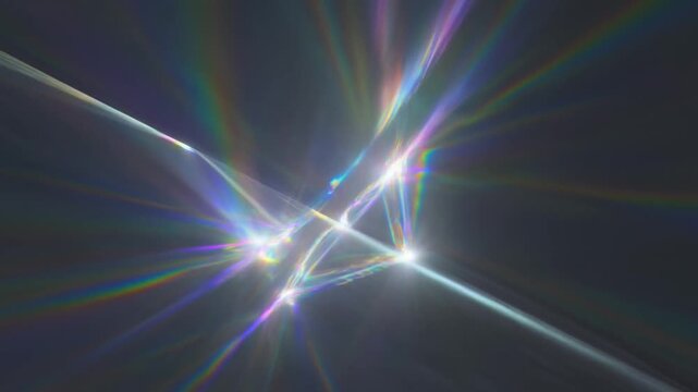 Tracking slow motion pan of abstract light refraction streaks and prism flares converging and radiating across dark atmospheric background