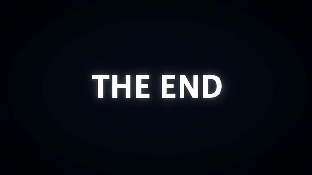 Slow fade in of bold capital the end text centered on dark screen with subtle glow static shot for cinematic closing card and finale